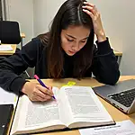 IELTS student focusing intently on a paragraph