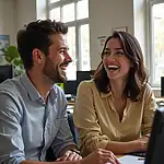 Colleagues laughing together in office