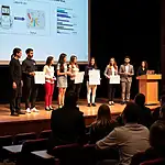 Student entrepreneurs presenting ideas at a pitch competition