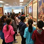 Students exploring cultural exhibits at school festival