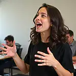 A person using expressive hand gestures while speaking